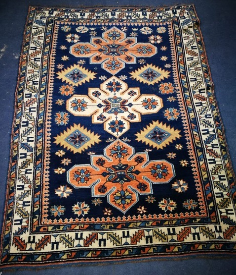 A Caucasian Shirvan blue ground rug 157 x 112cm